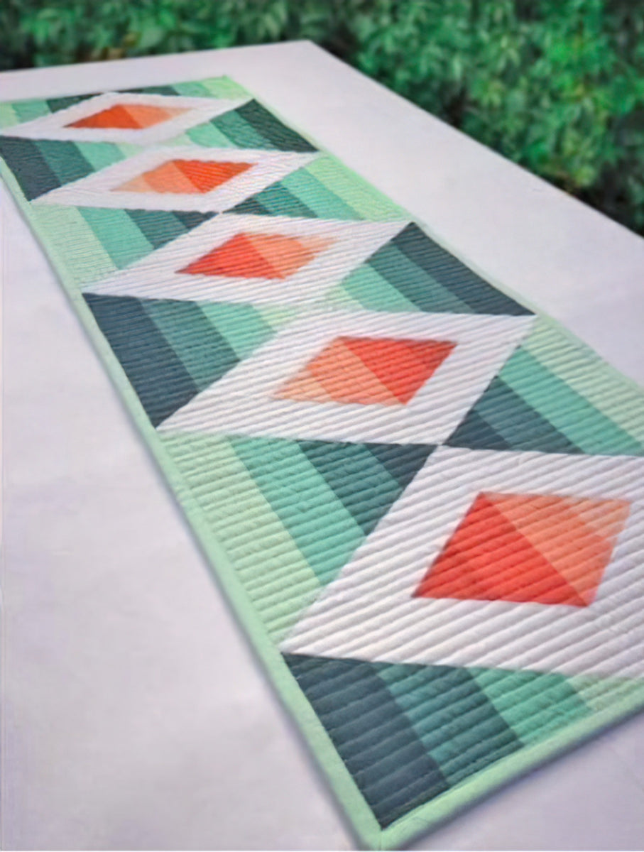 Krista Moser's Aztec Diamond Quilt Kit featuring popular Kona Solids